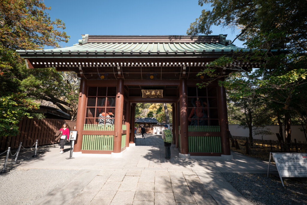 The entrance gate to Kotoku-in Temple in Kamakura, marking the approach to the Great Buddha grounds.