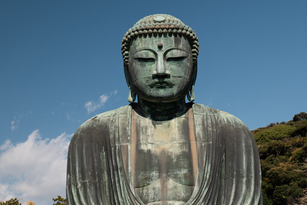 Detail of the face of the Great Buddha (Daibutsu) at Kotoku-in Temple in Kamakura.