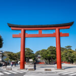 Red torii gate at the entrance of Tsurugaoka Hachimangu Shrine in Kamakura, Japan.