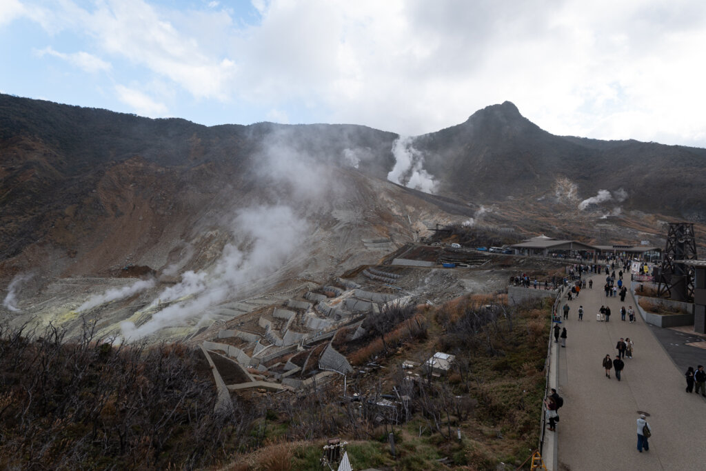 Elevated walkways and viewing platforms overlooking the active volcanic valley at Owakudani in Hakone.