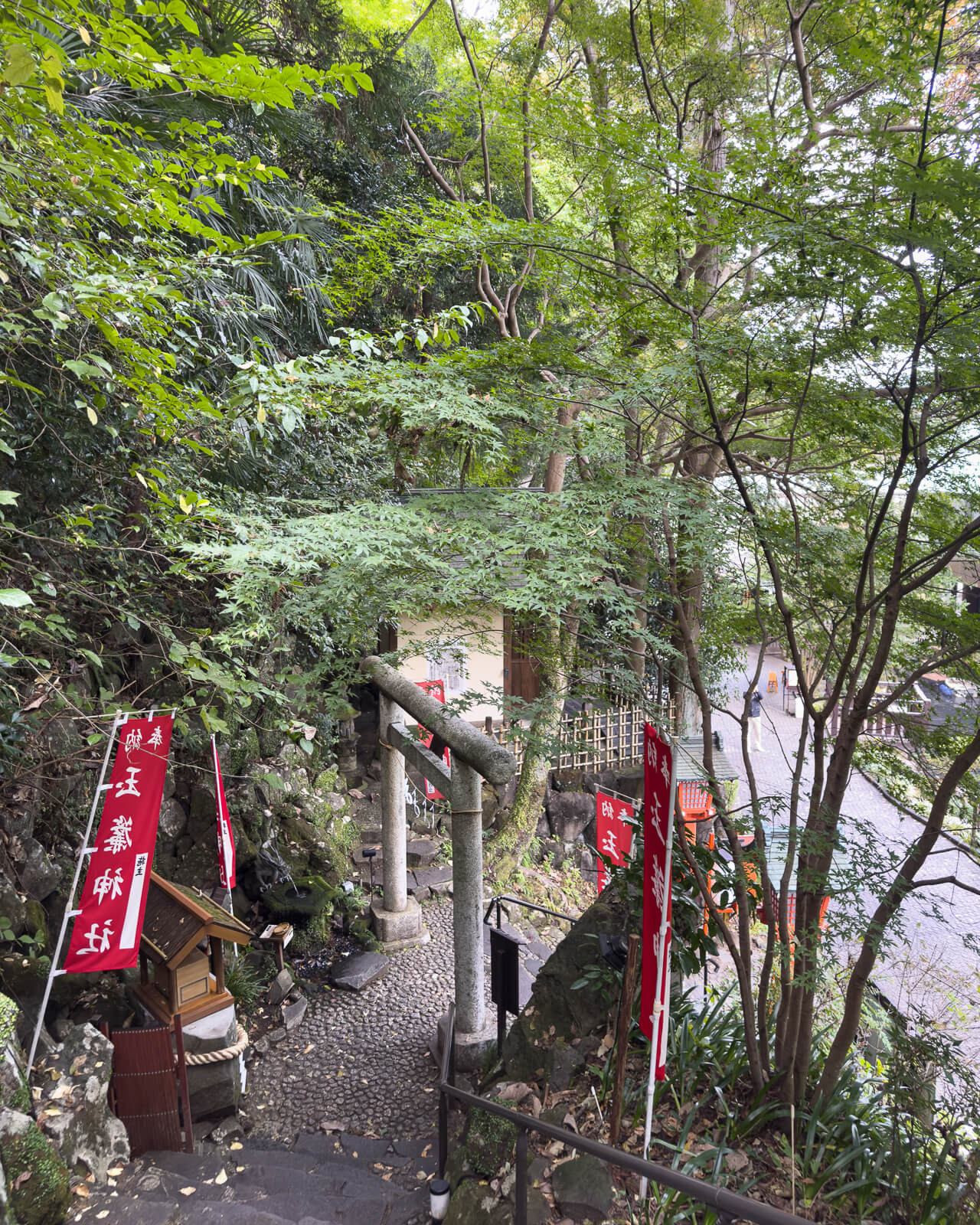Elevated view down the short stairway leading between Tamadare Shrine and the lower garden path.