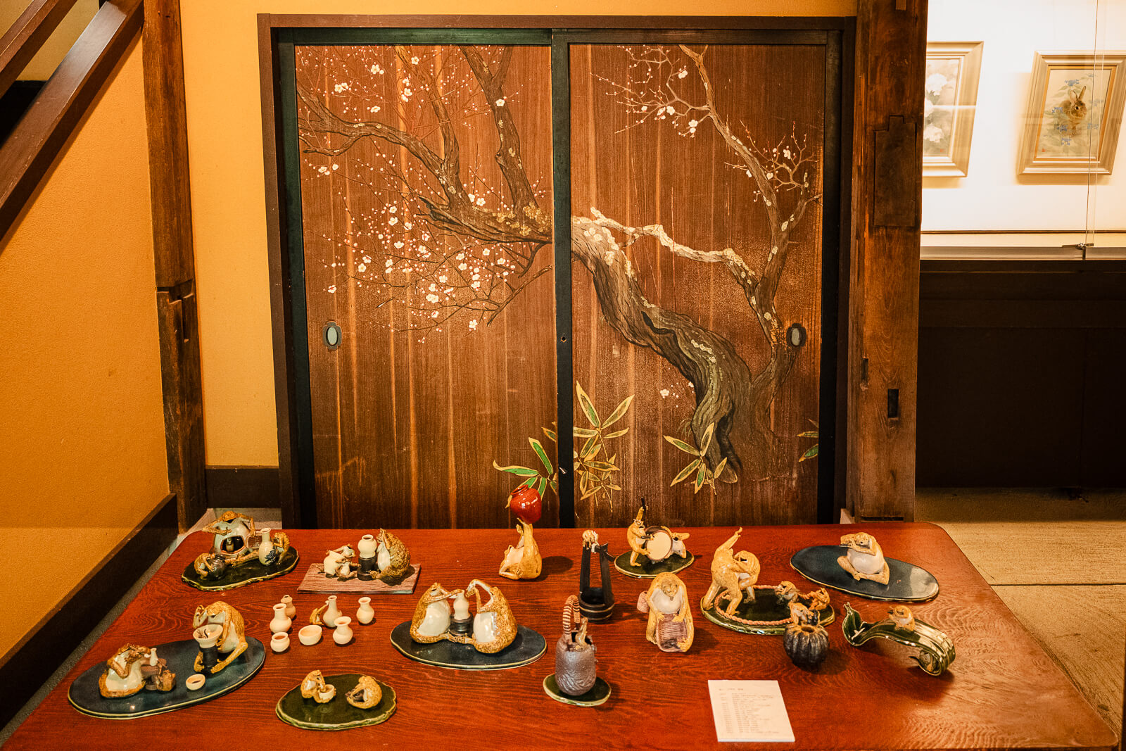 Painted sliding doors and ceramic artwork inside the Kitakamakura Old Folk House Museum