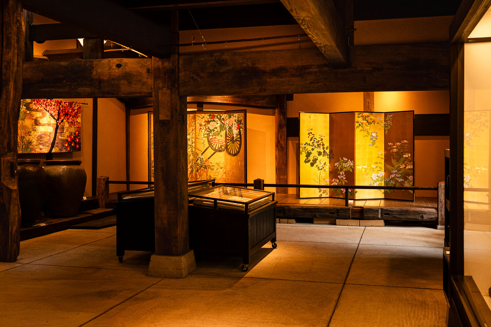 Historic exhibition hall displaying artwork inside the Kitakamakura Old Folk House Museum