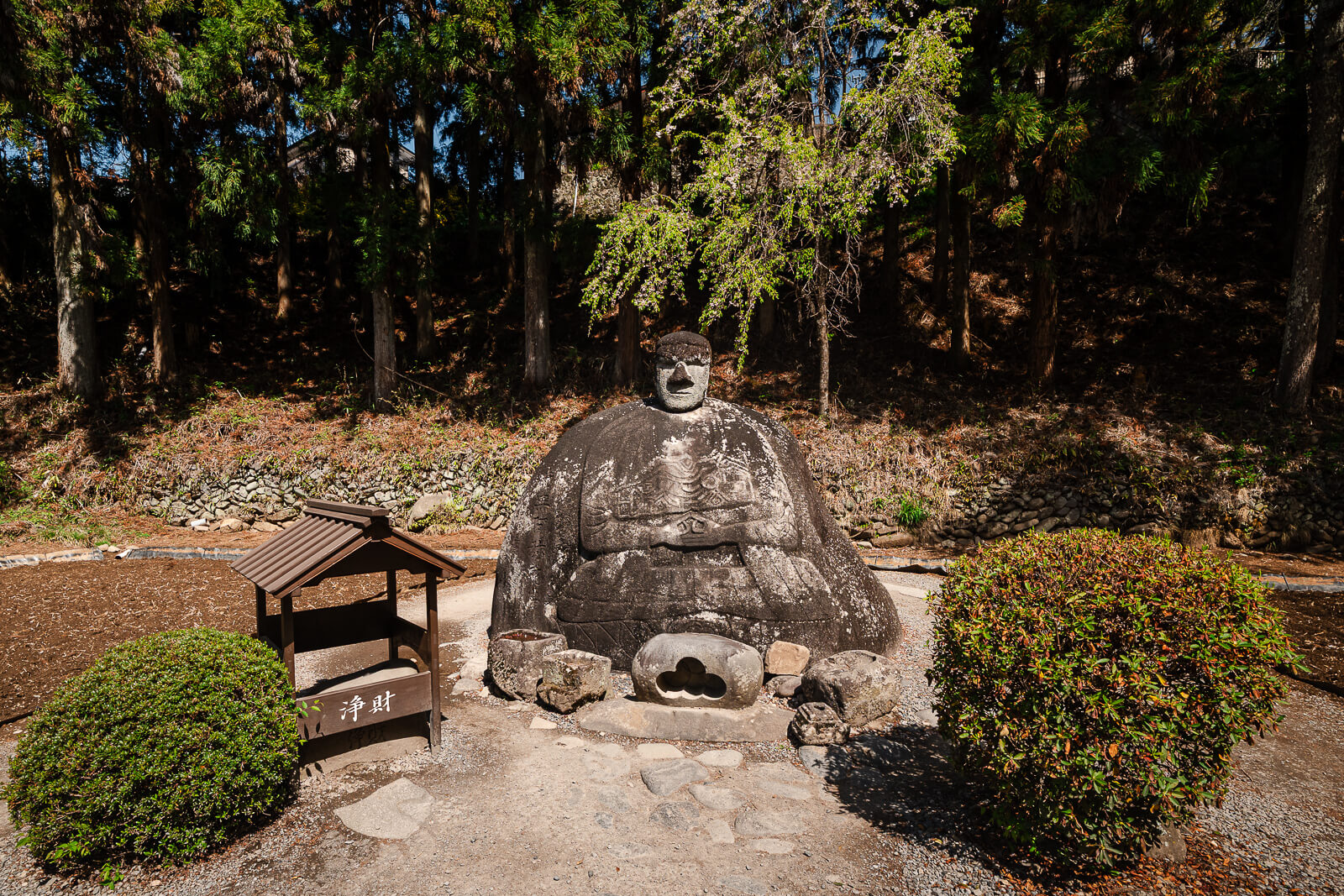 Manji-no-Sekibutsu stone Buddha statue beside the riverside near Suwa Taisha Shimosha Harumiya