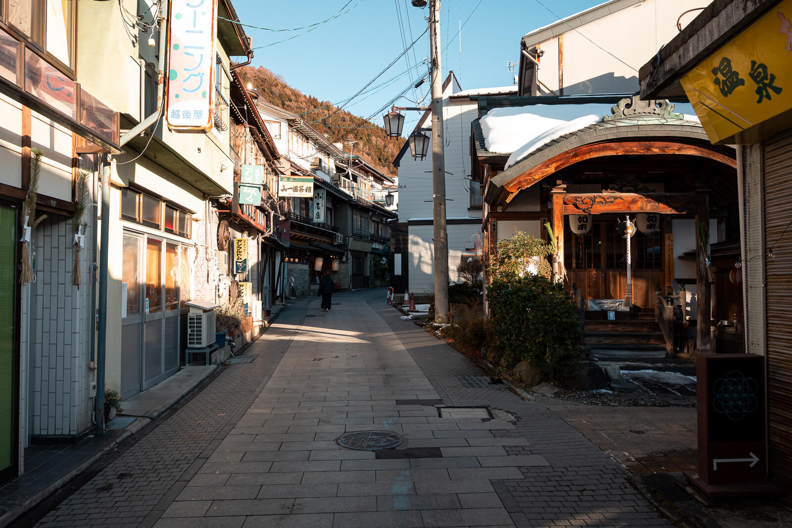 Narrow main street lined with wooden ryokan at Shibu Onsen, Yamanouchi