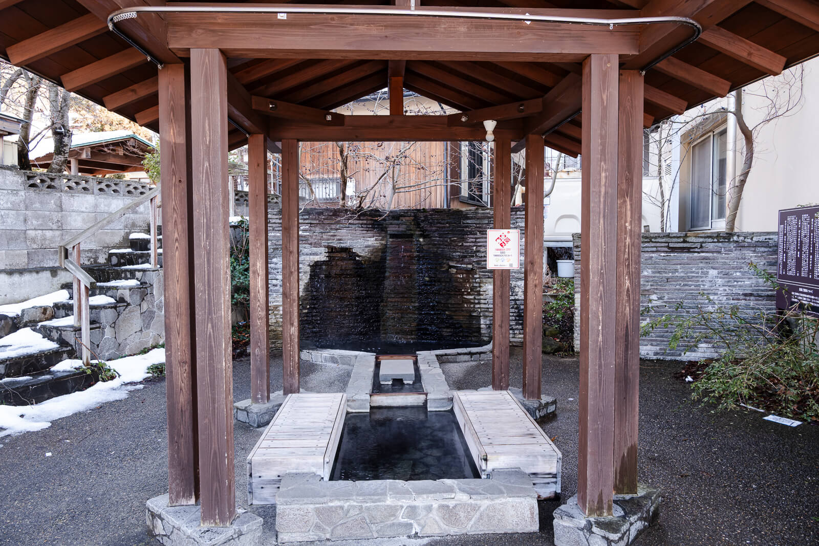 Covered public ashiyu foot bath structure in Yudanaka Onsen