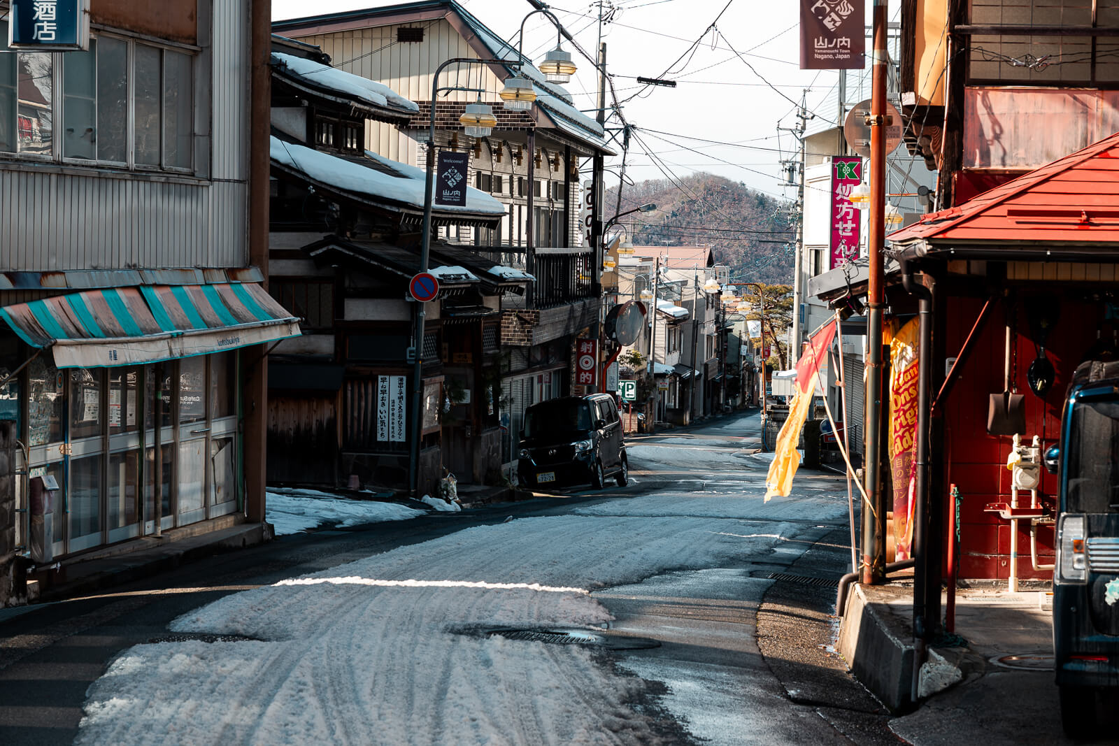 Winter street scene in Yudanaka used by ski travelers heading to Shiga Kogen