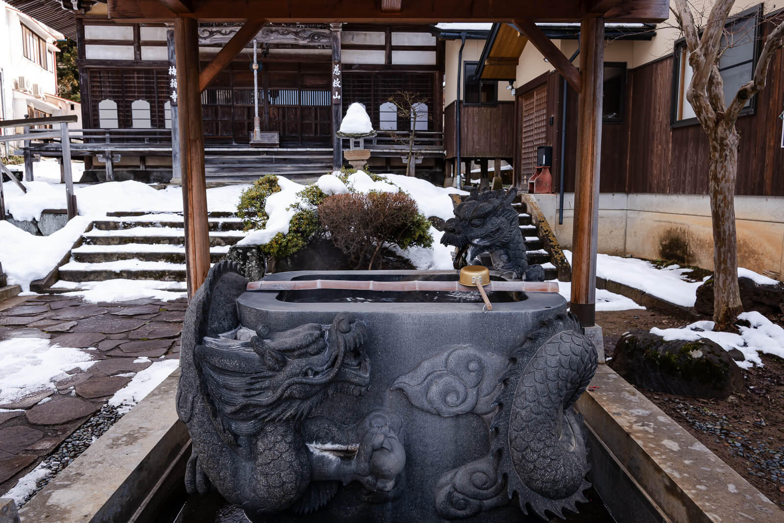 Stone purification basin at Baio-ji Temple in Yudanaka