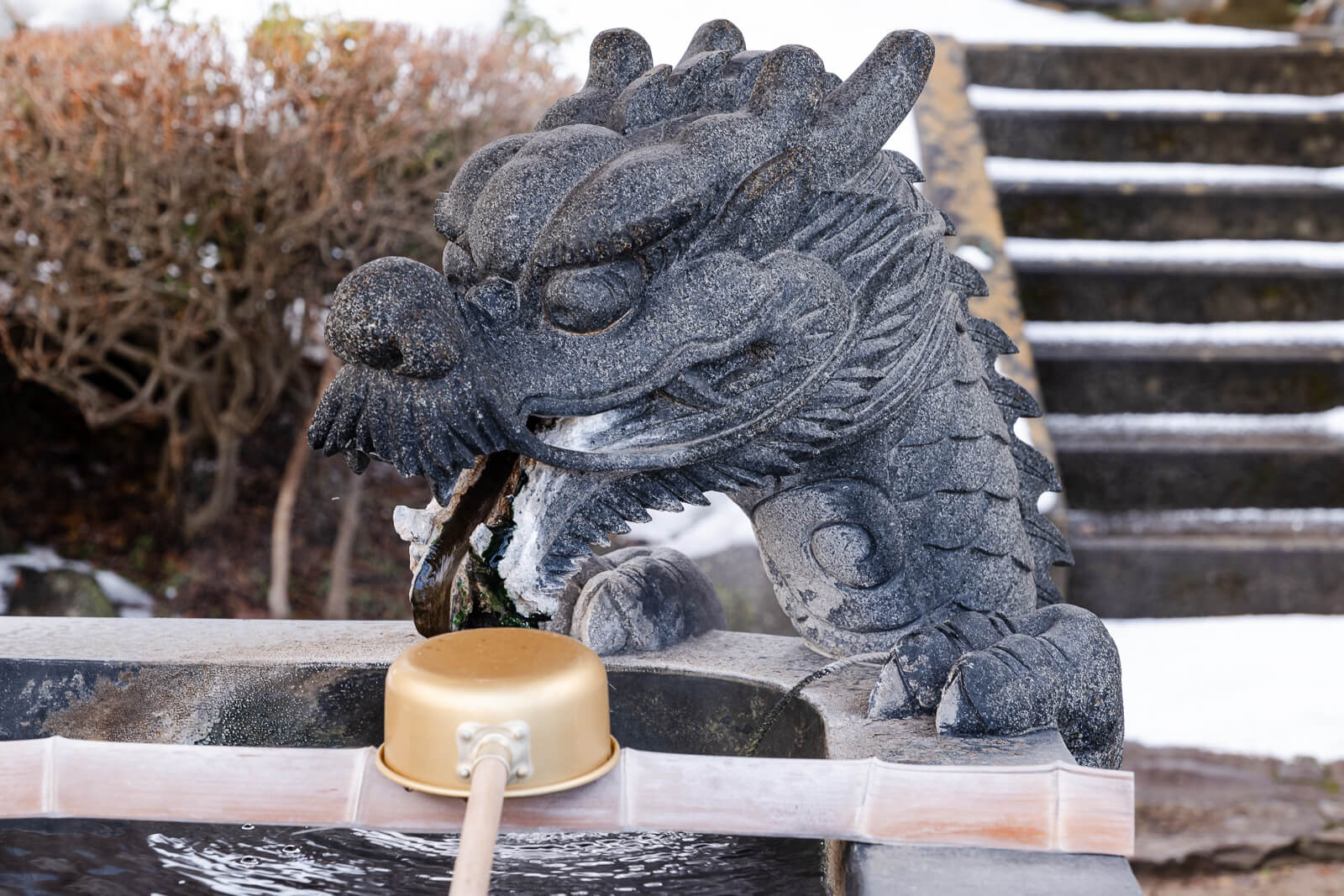 Carved dragon figure at Baio-ji Temple purification basin