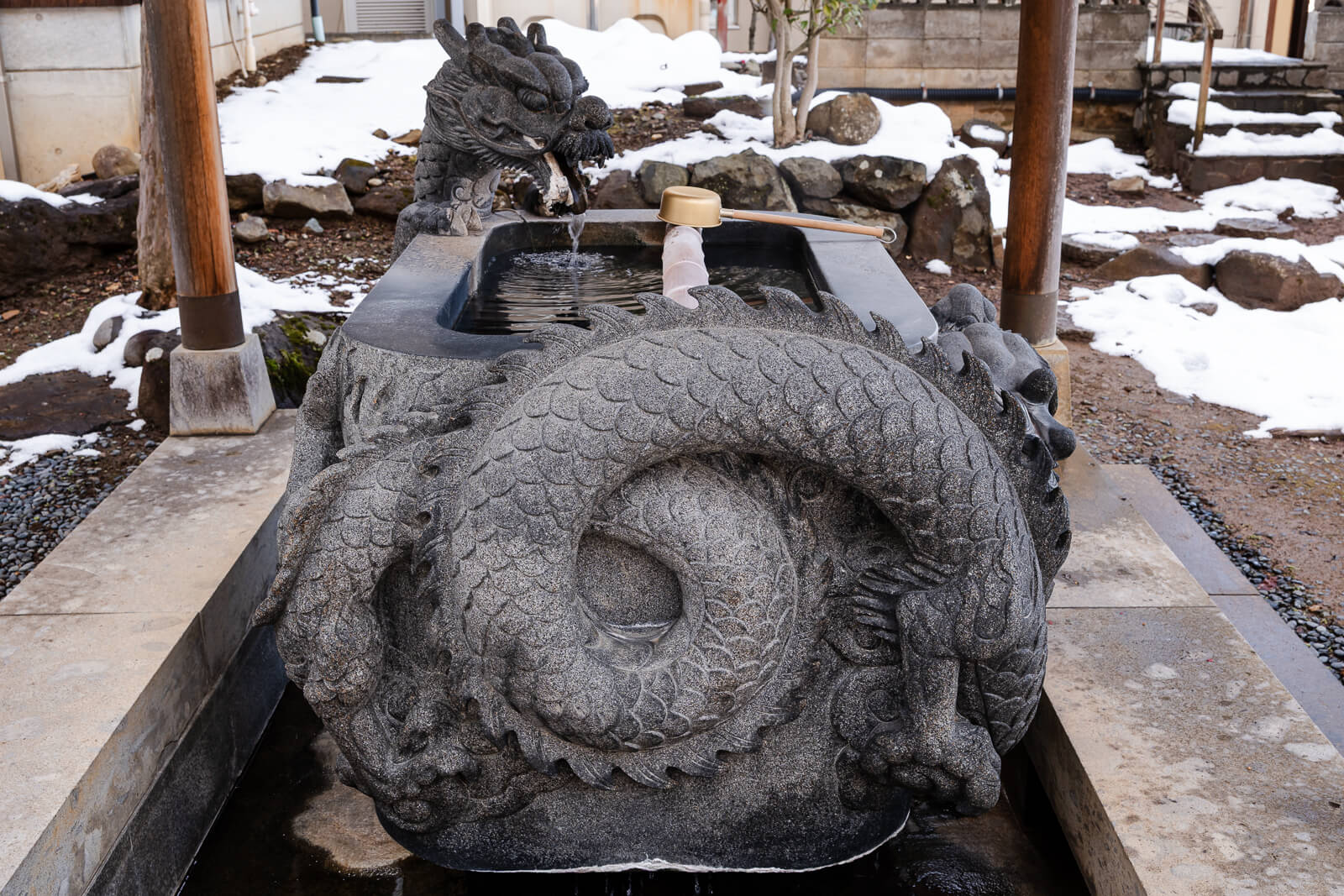 Stone purification basin at Baio-ji Temple in Yudanaka