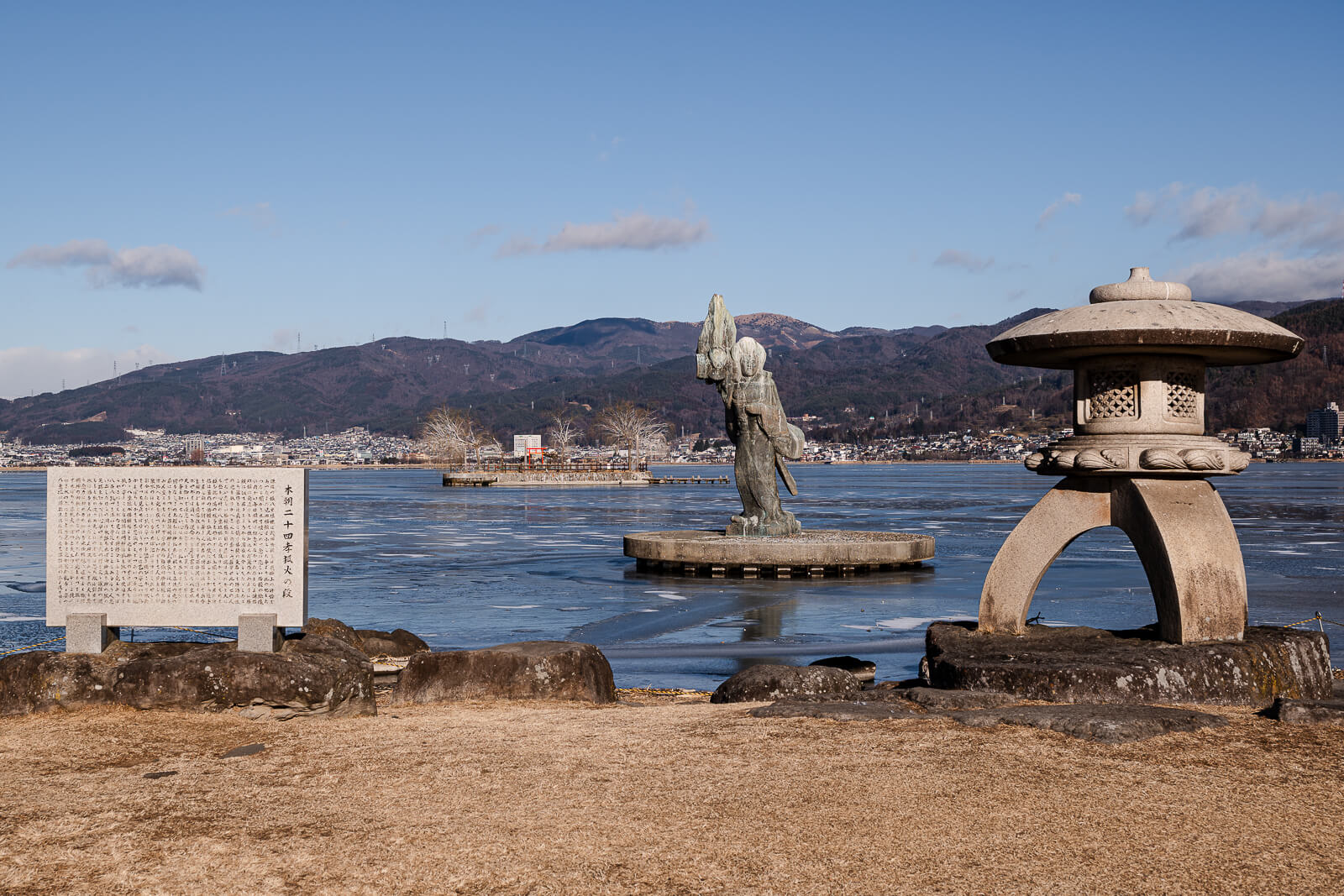 Sculptural feature and shoreline view at Sekicho Park Lake Suwa