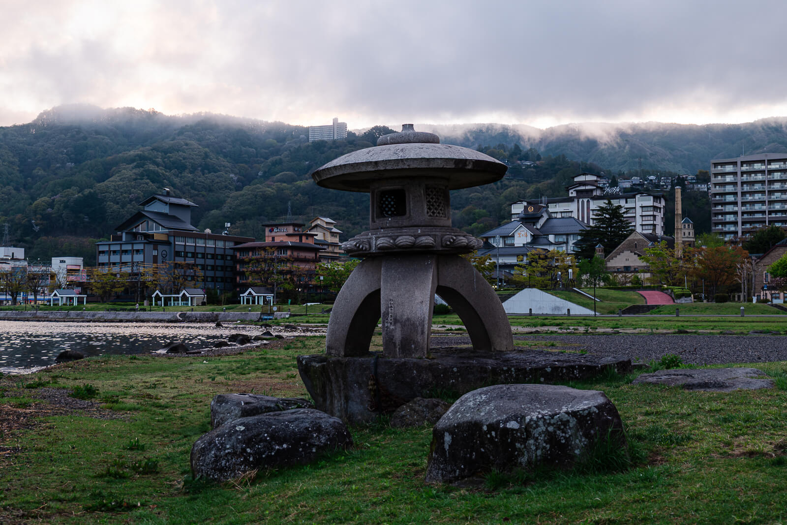 Sculpture standing in water at Lake Suwa shoreline