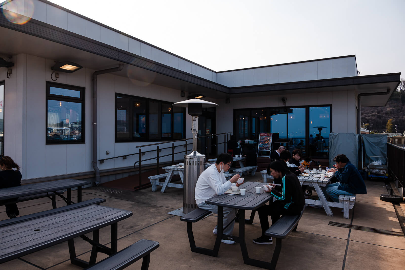 Outdoor deck seating at TOTOCO Odawara overlooking the coast