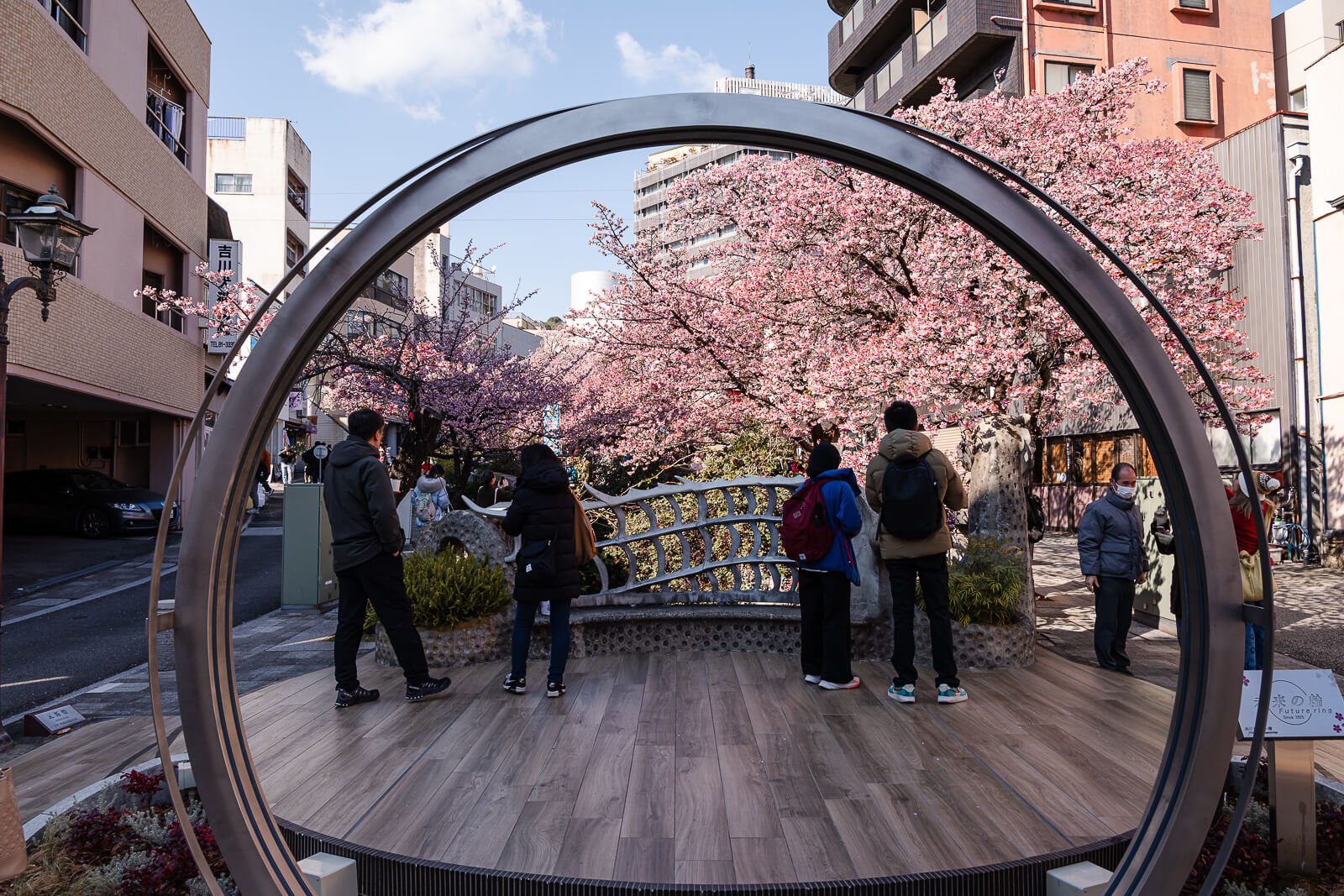 Circular sculpture landmark along the Itokawa Promenade walkway in Atami