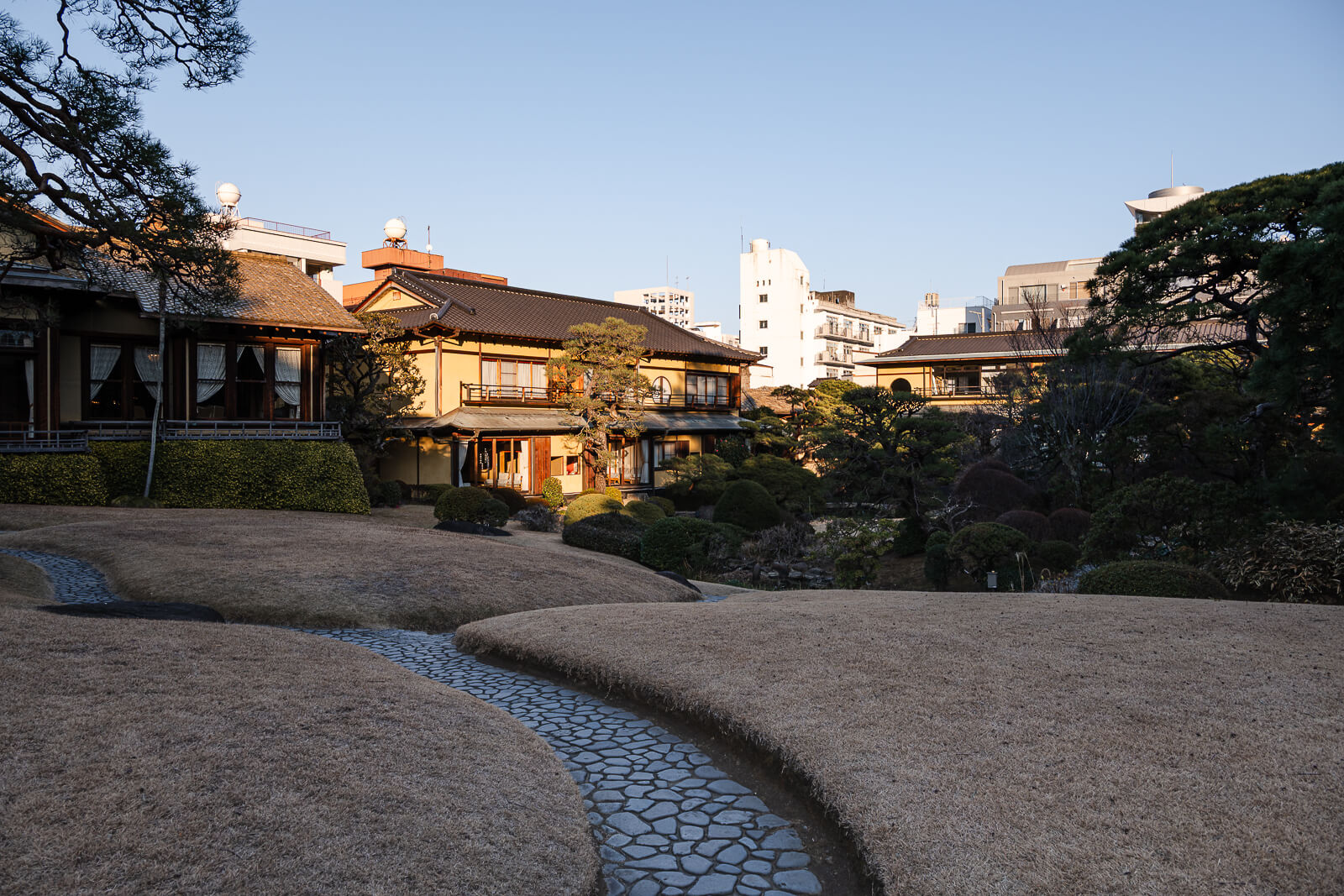 Garden pond and traditional villa building at Kiunkaku in Atami