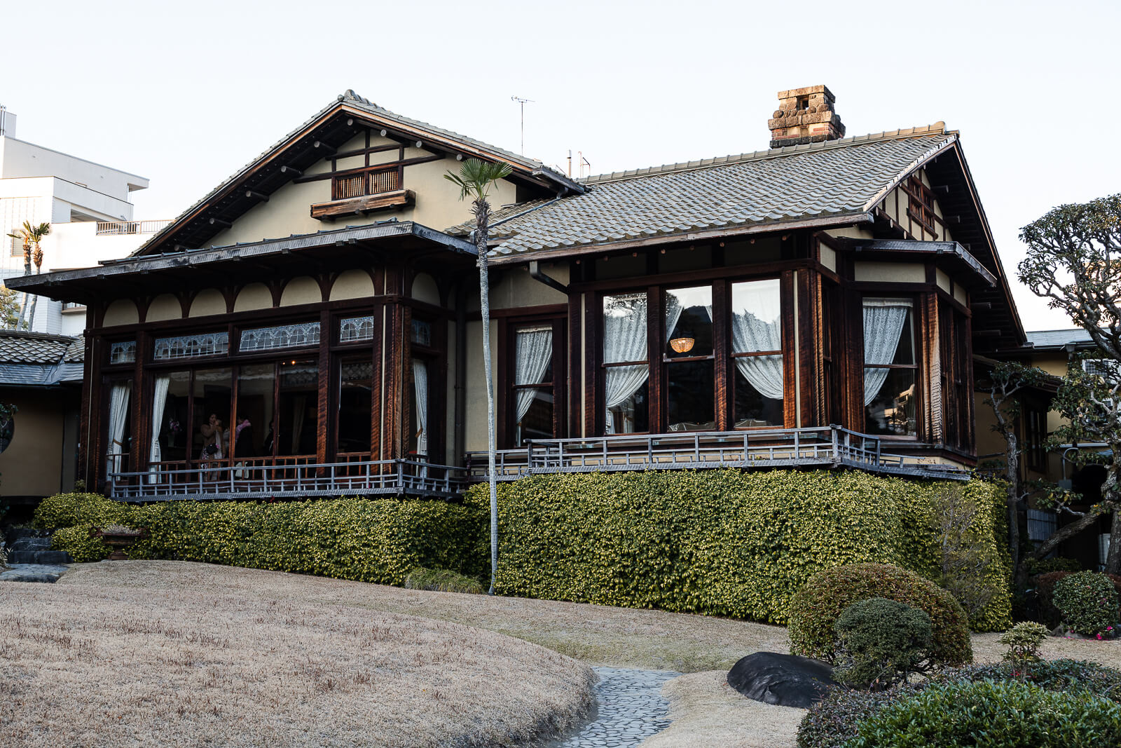 Exterior view of Kiunkaku historic villa building above the garden in Atami