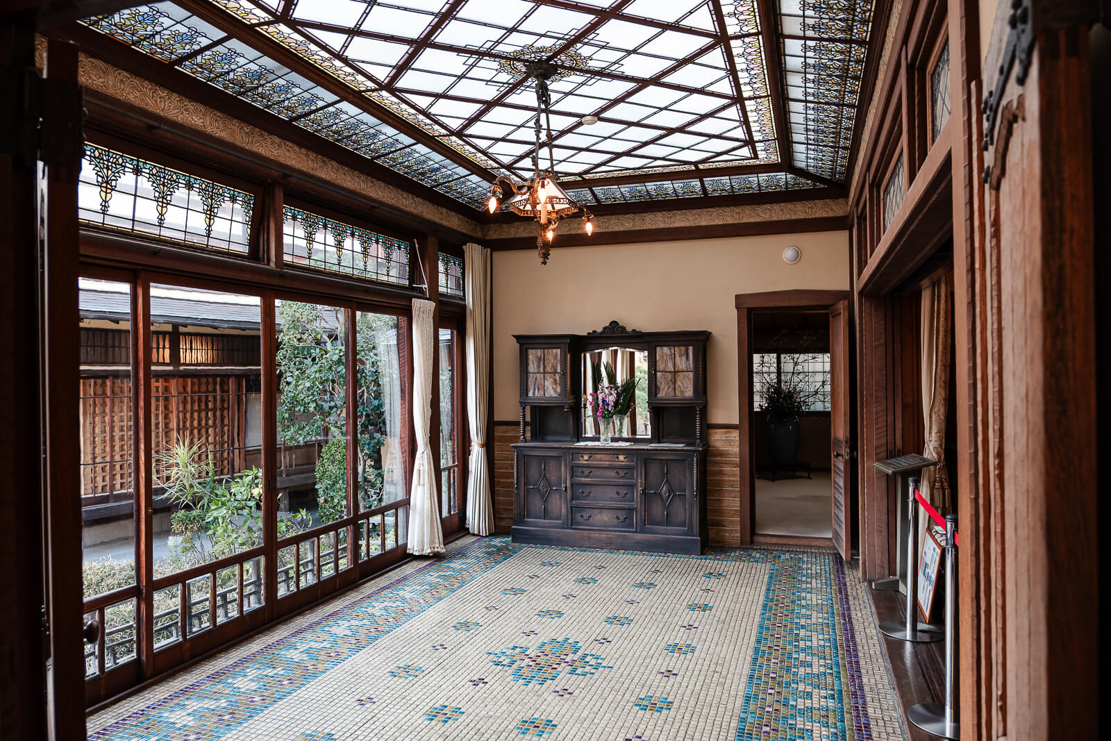 Upper corridor with glass ceiling inside Kiunkaku historic villa in Atami