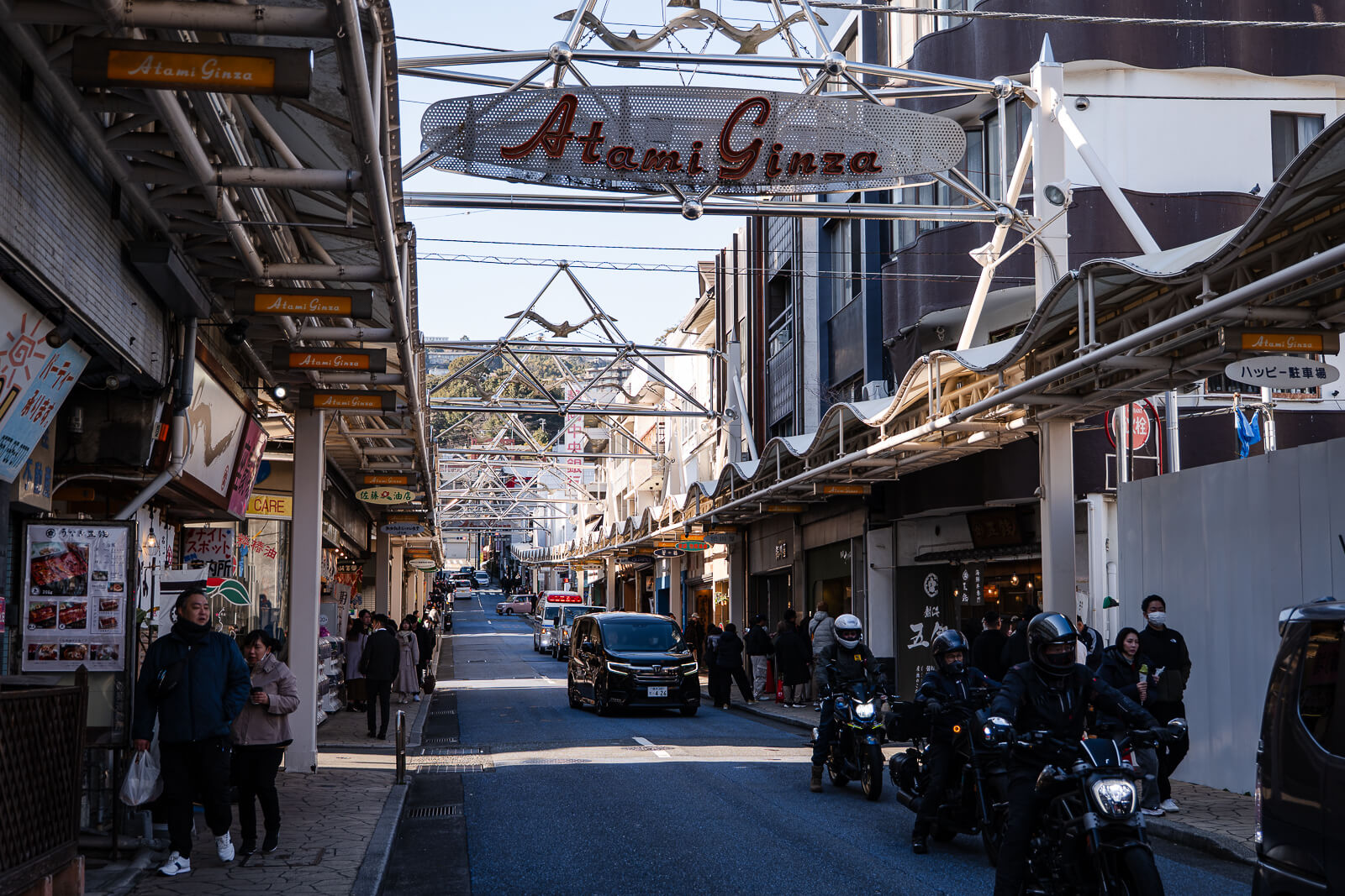 Atami Ginza shopping street with storefronts and pedestrian walkway in central Atami