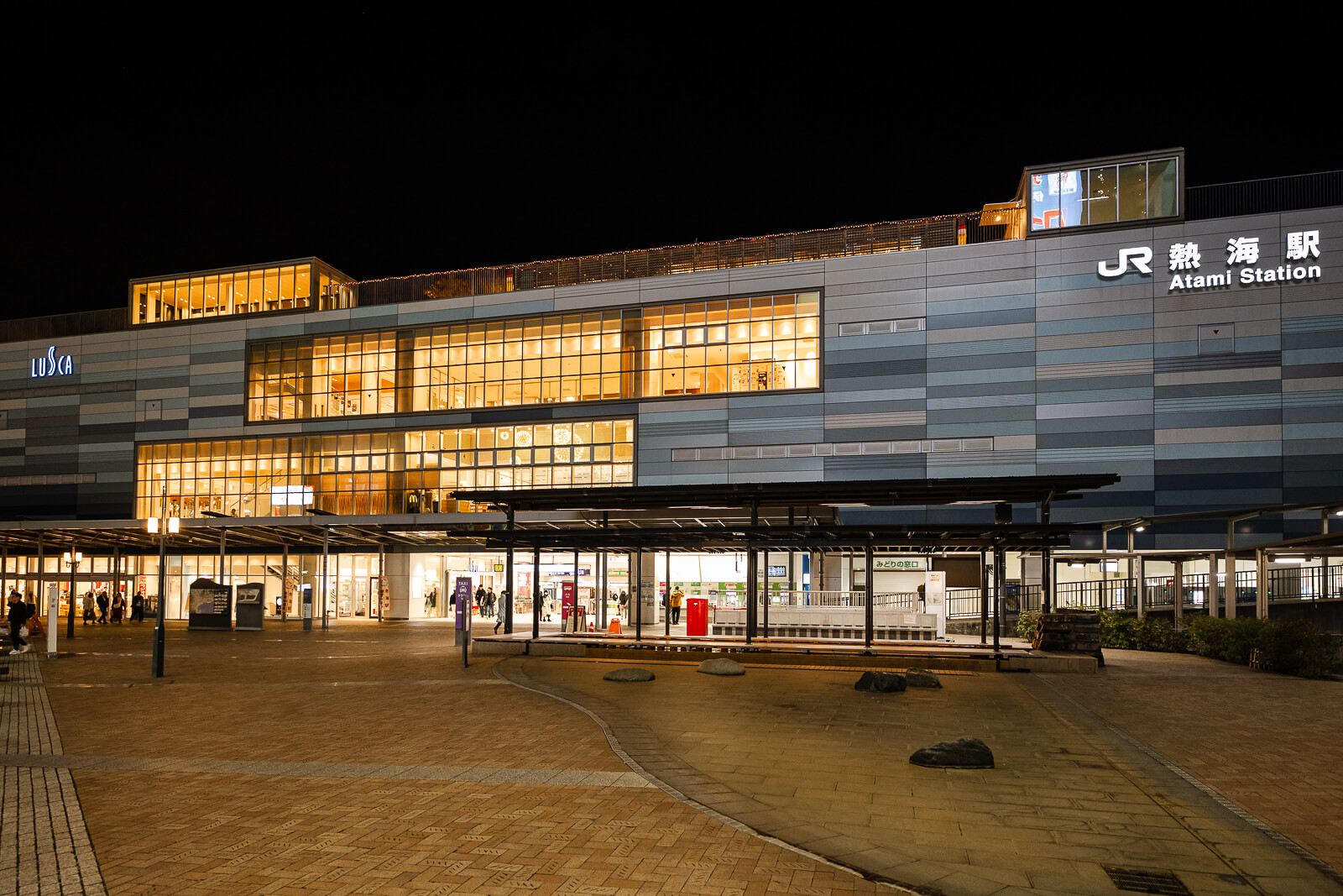 Atami Station main entrance with surrounding plaza and transport access in Atami