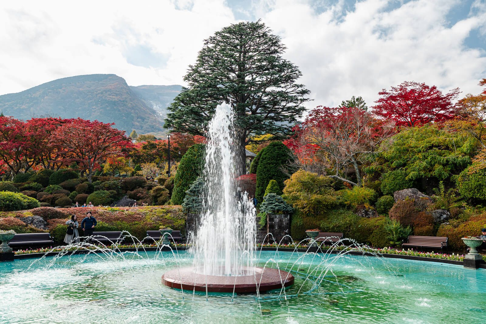 Central fountain surrounded by autumn gardens at Hakone Gora Park