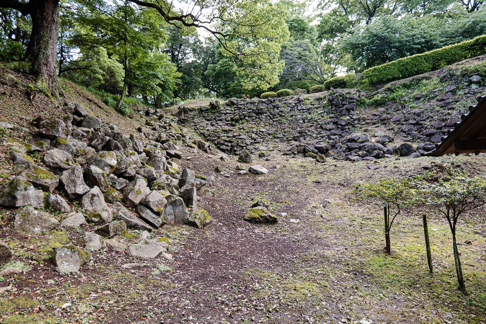 Stone wall remains and open ground at Ishigakiyama Castle Ruins overlooking Odawara