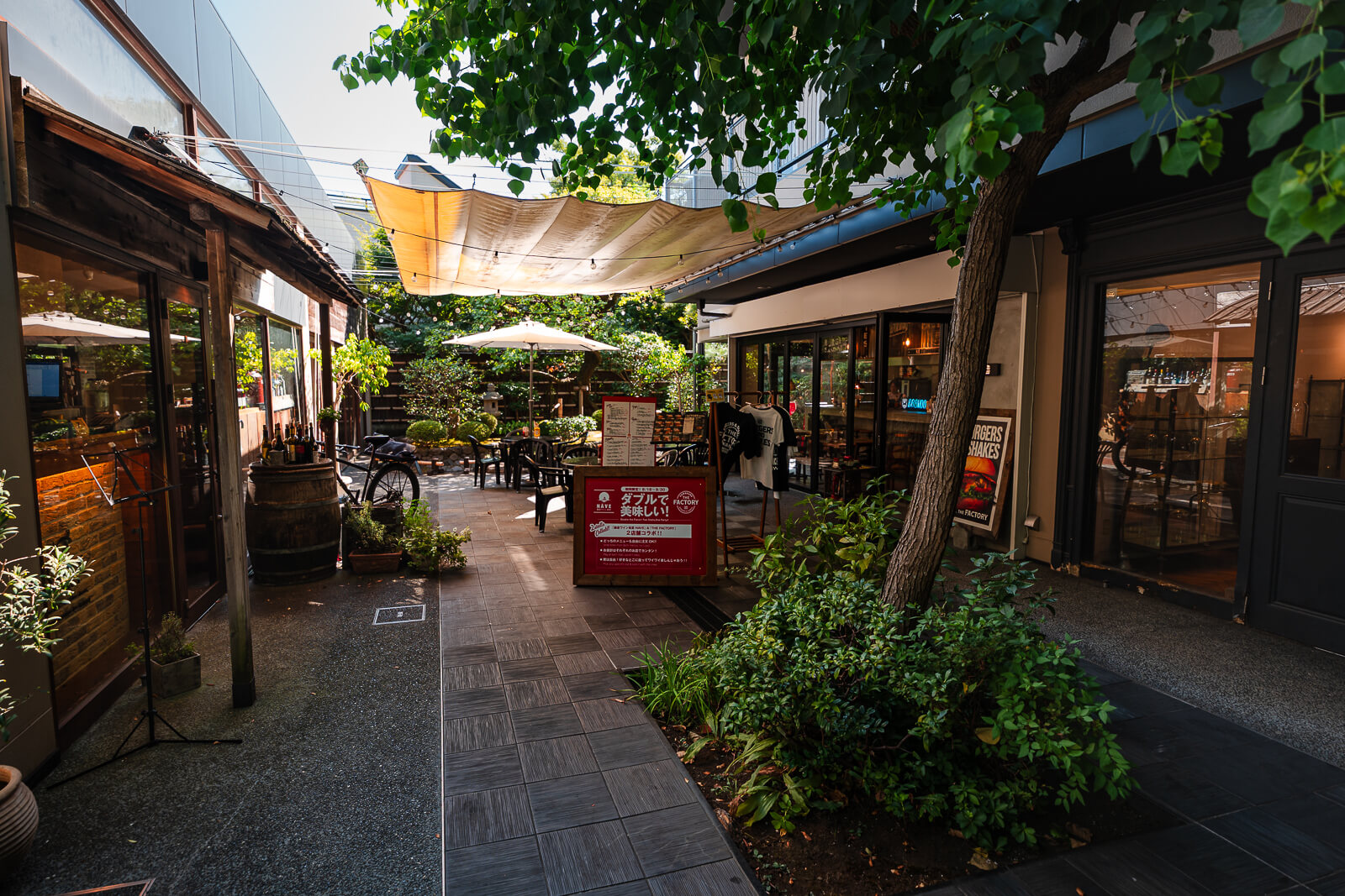 Quiet side alley off Komachi-dori with smaller shops and greenery