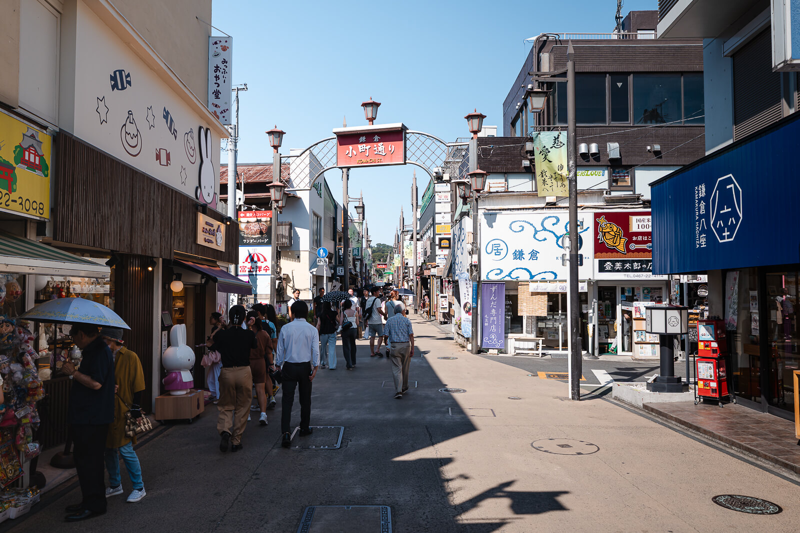 Crowds moving through Komachi-dori narrow shopping street in Kamakura
