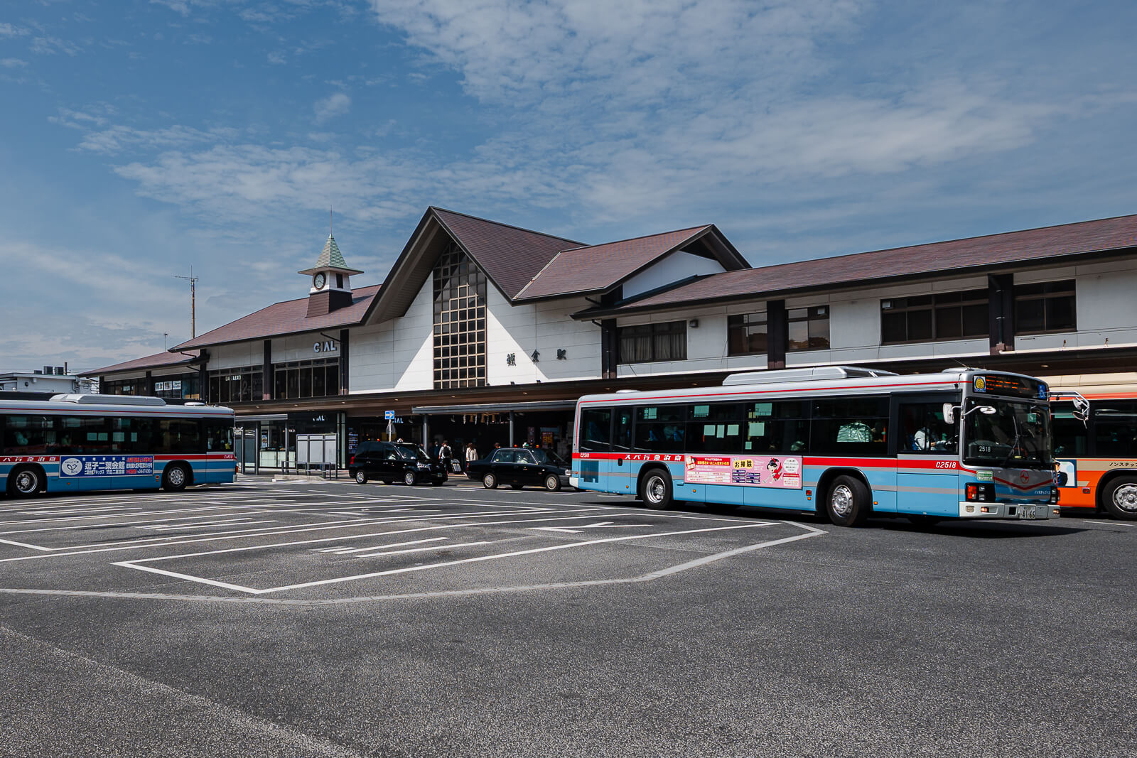 Kamakura Station east exit and bus terminal with local buses parked in front of the station building