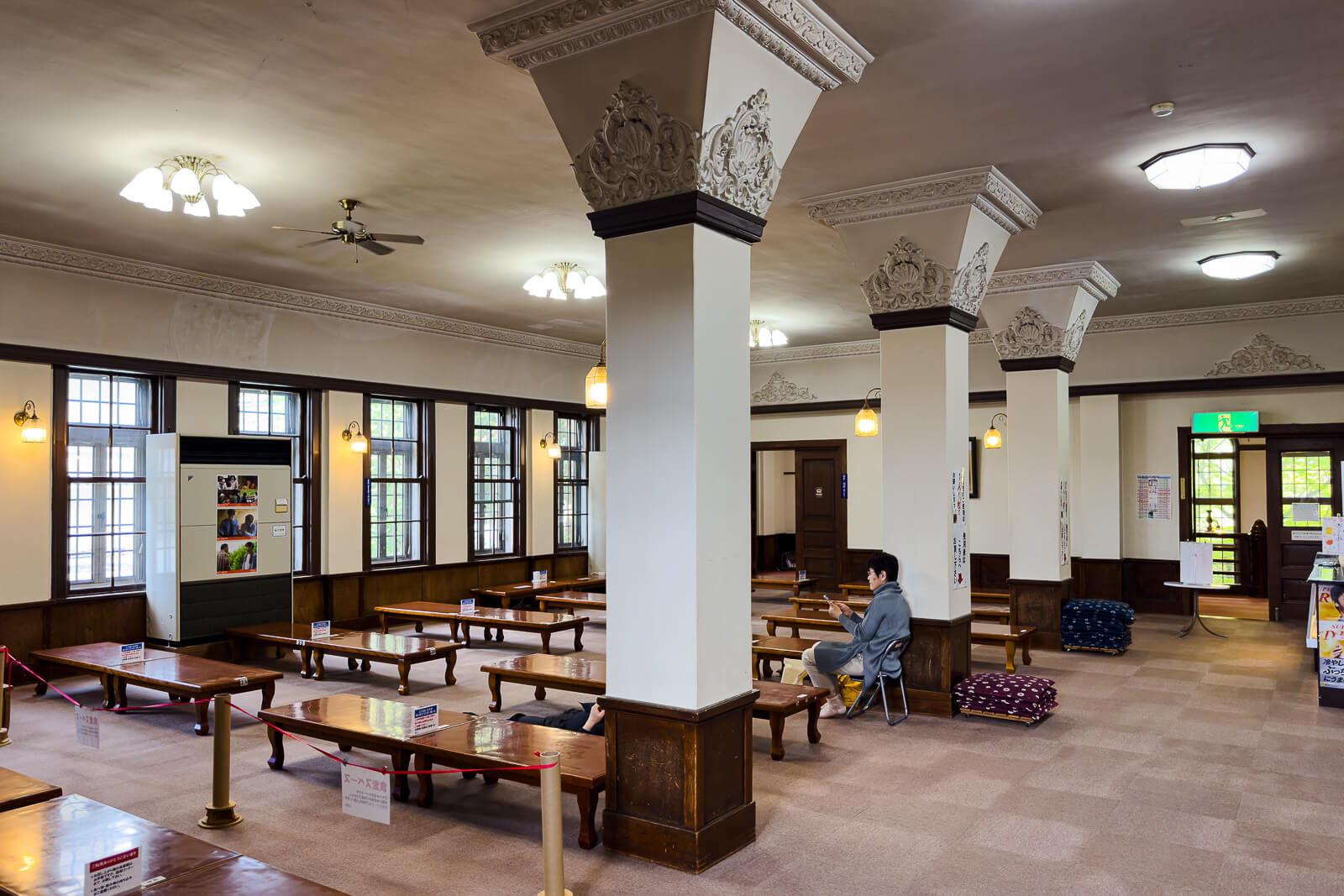 Rest hall seating area inside Katakurakan public bathhouse in Kamisuwa Onsen
