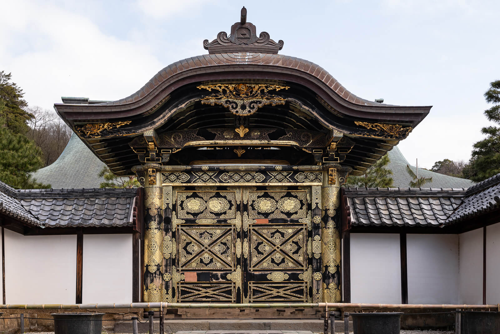 Outer face of the ornate gilded Karamon Gate at Kencho-ji Temple