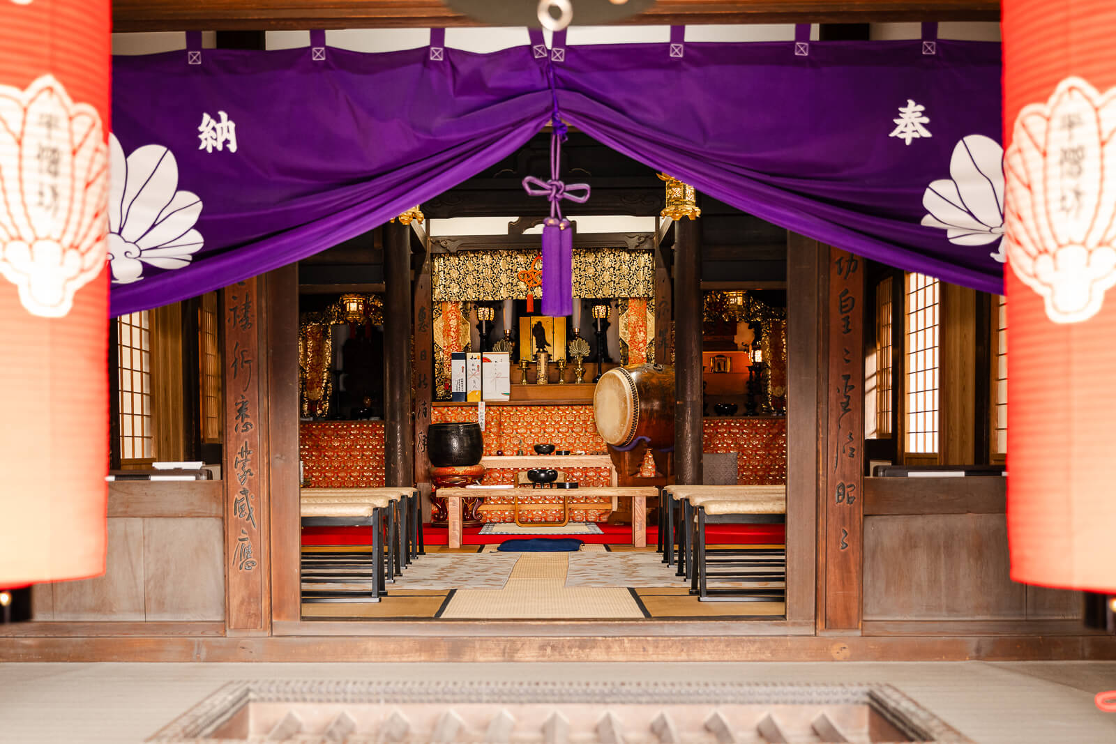 Buddhist altar framed by purple curtains inside Hansobo Shrine at Kencho-ji Temple