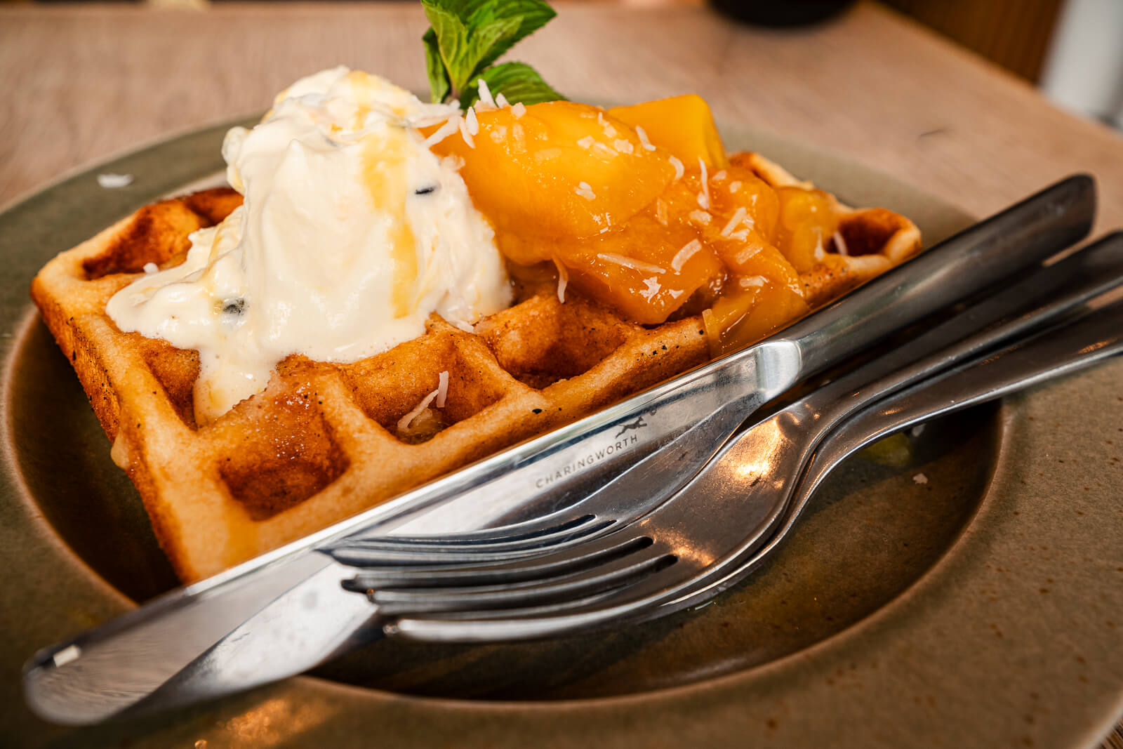 Waffle topped with mango, cream, and ice cream at Verve Coffee Roasters in Kita-Kamakura