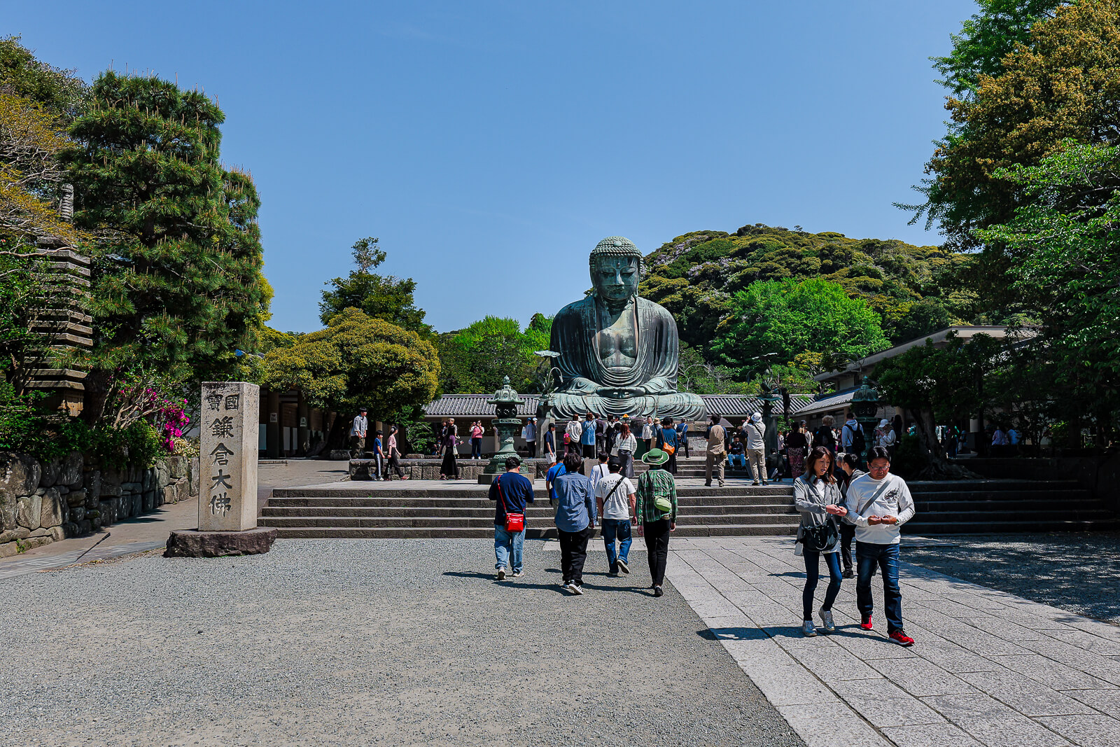 Visitors walking through the courtyard at Kōtoku-in Temple