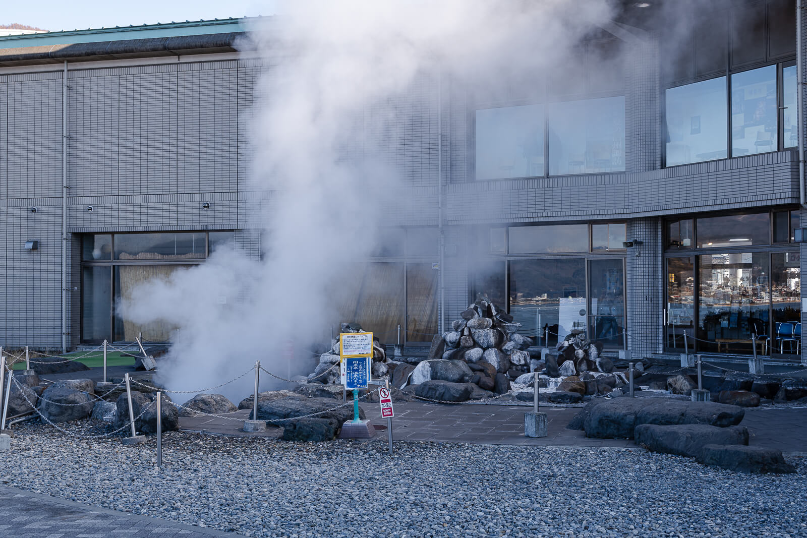 Wide view of Lake Suwa Geyser Center and steam plume in Kamisuwa
