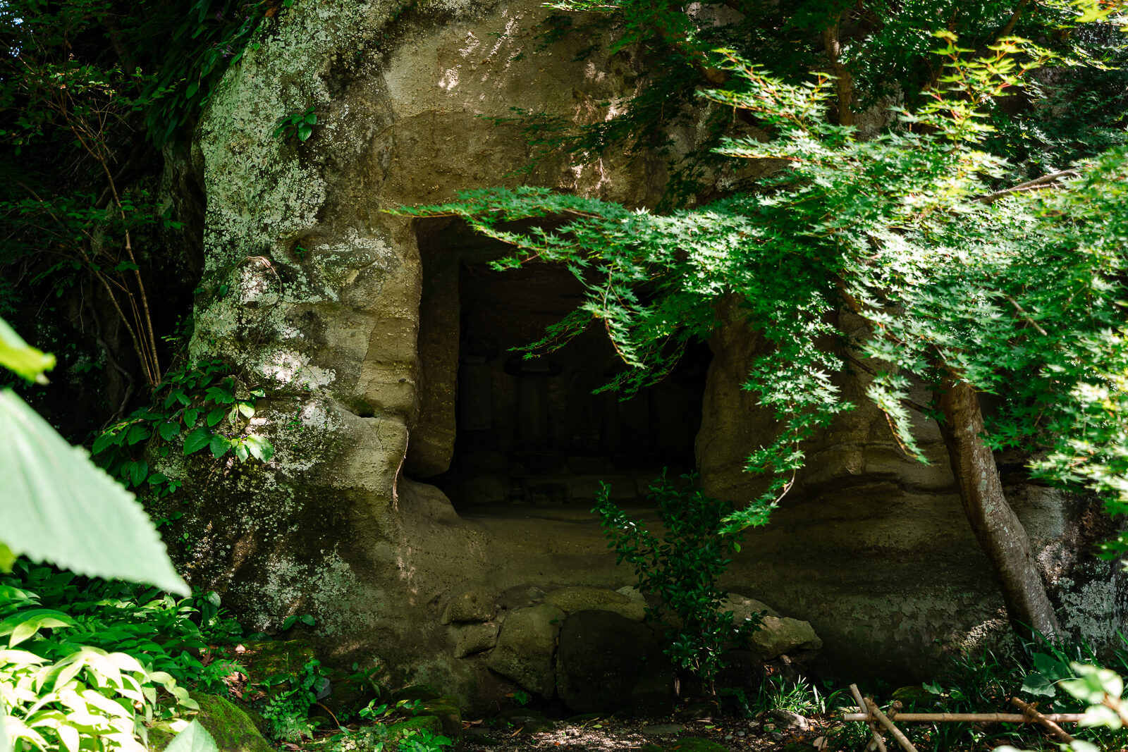 Stone chamber surrounded by greenery at Meigetsu-in Temple in Kita-Kamakura