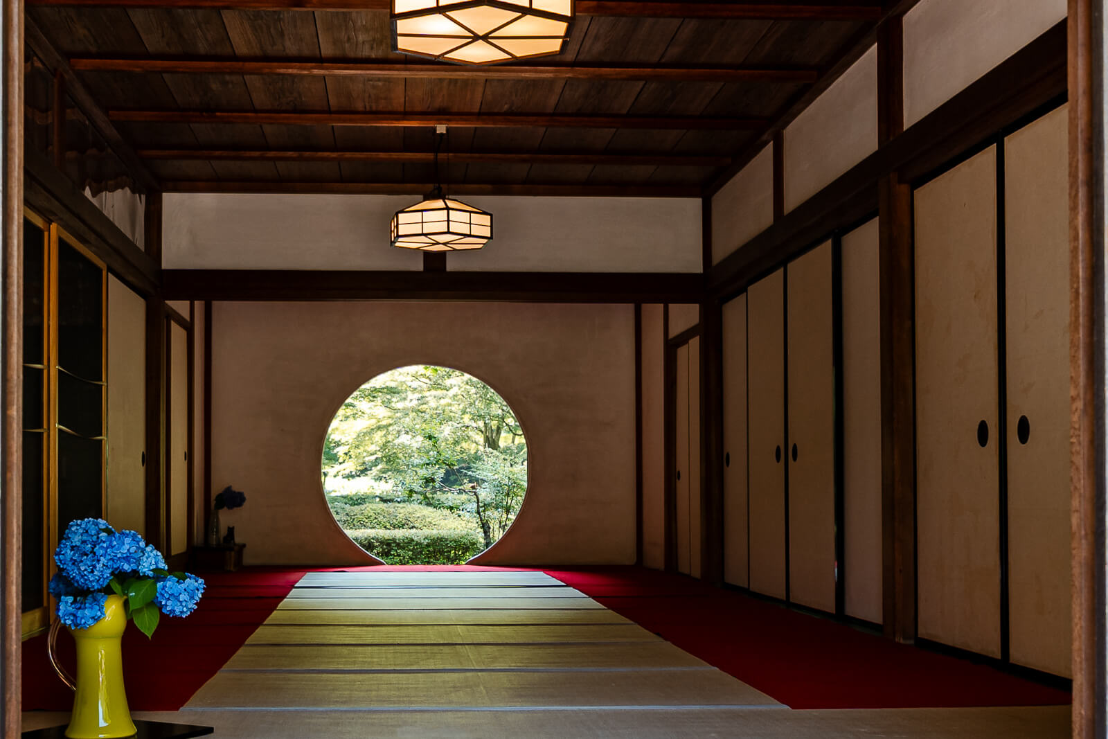 Circular Window of Enlightenment framing the garden at Meigetsu-in Temple