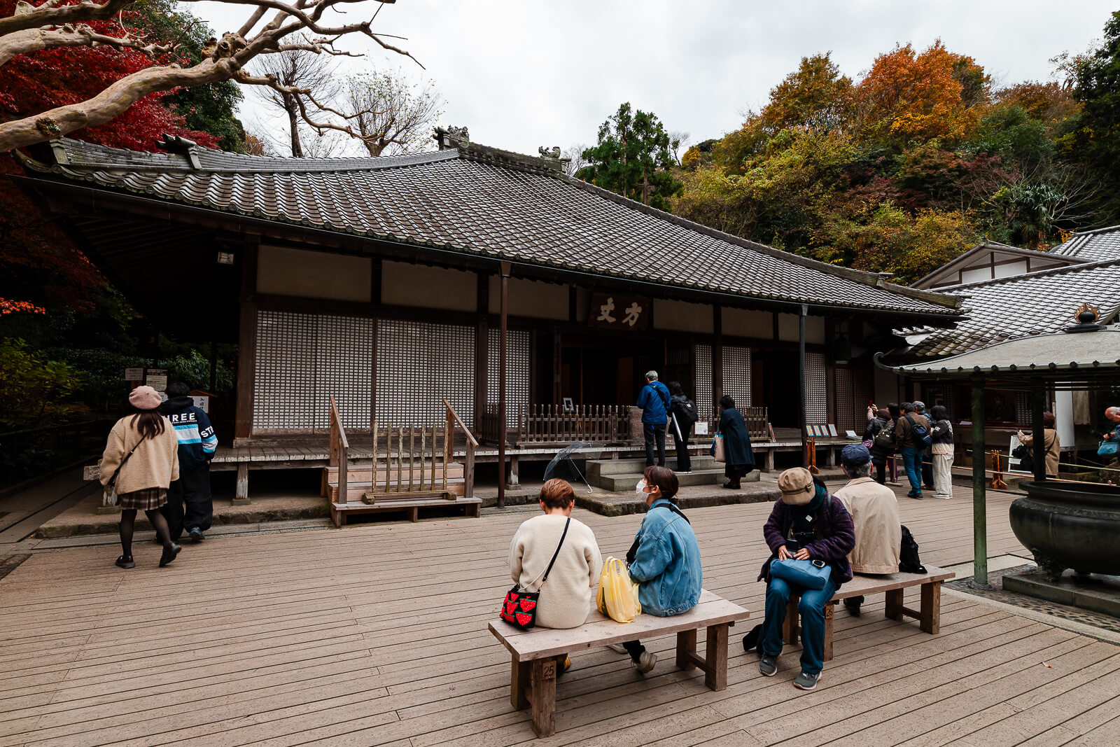 Hojo building at Meigetsu-in Temple with visitors seated outside