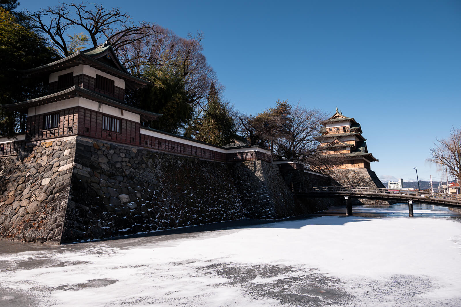 Stone moat and walking path around Takashima Castle in winter