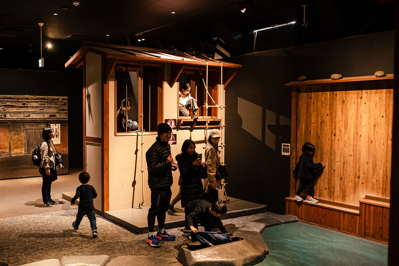 Families and children using ninja training structures inside Odawara Castle Ninja Museum