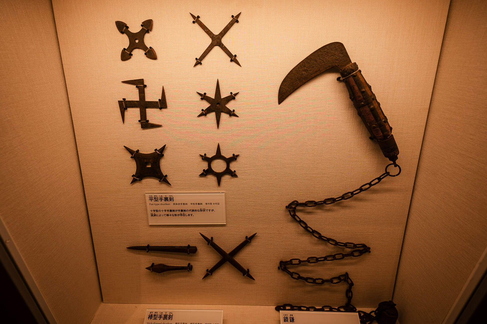 Display of ninja tools including shuriken and weapons inside Odawara Castle Ninja Museum