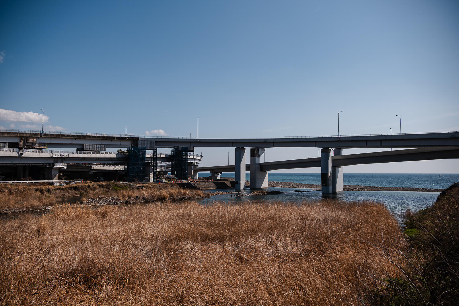 Hayakawa River and bridge near Odawara Fishing Port leading toward Sagami Bay`