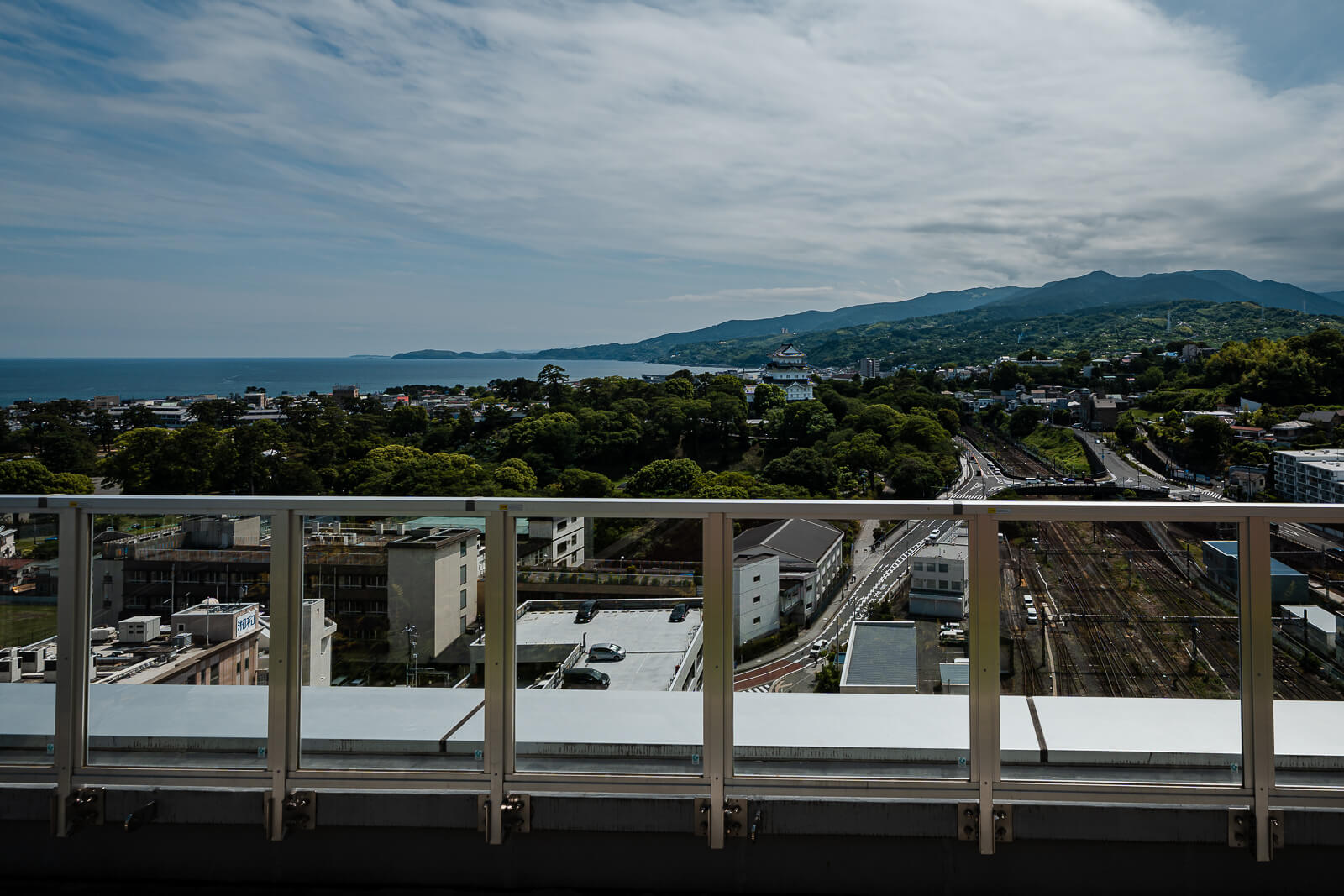 View toward Sagami Bay and the mountains from Minaka Odawara rooftop terrace