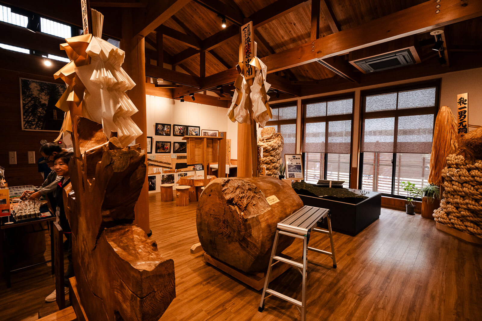 Interior log display inside the Onbashirakan Yoisa Museum near Suwa Taisha Harumiya.