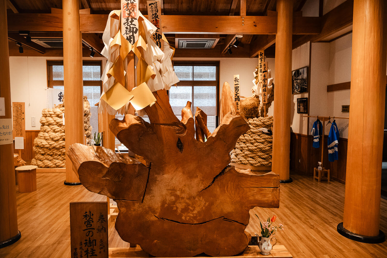 Large sacred log display inside the Onbashirakan Yoisa Museum near Harumiya.