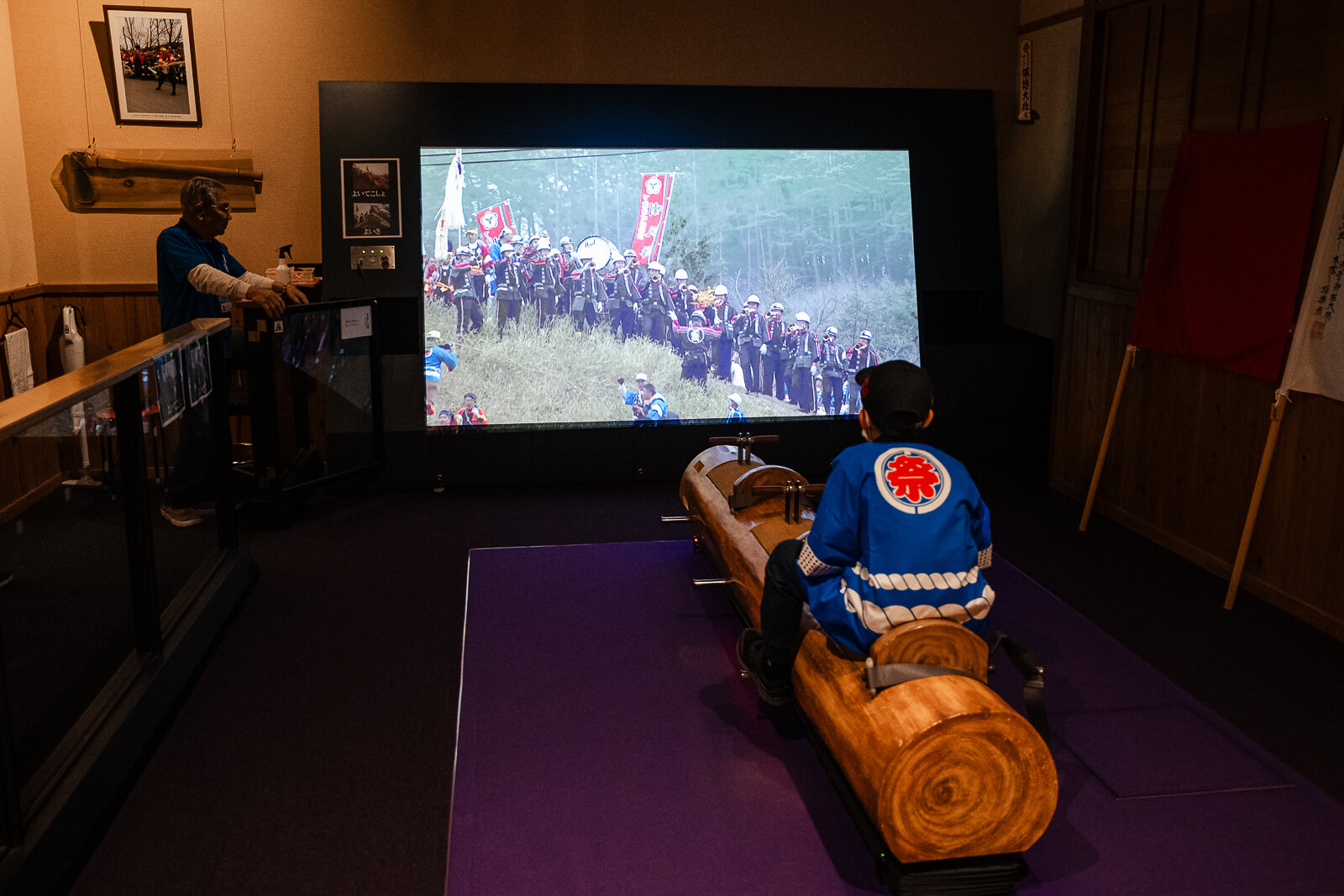 Projection room showing Onbashira festival footage inside the Onbashirakan Yoisa Museum.