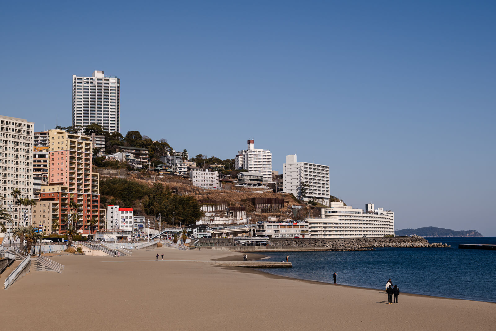 Open view of Atami Sun Beach showing broad sand and calm water