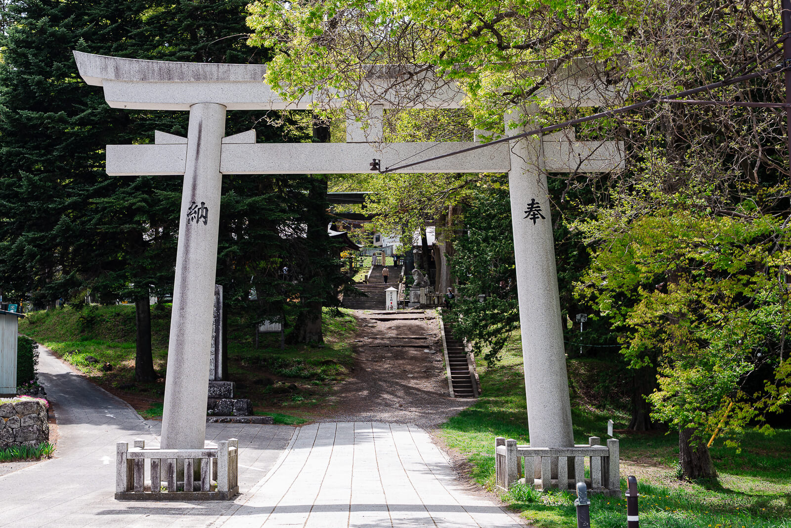 Roadside torii gate entrance to Suwa Taisha Kamisha Maemiya in Chino near Lake Suwa, Nagano Prefecture
