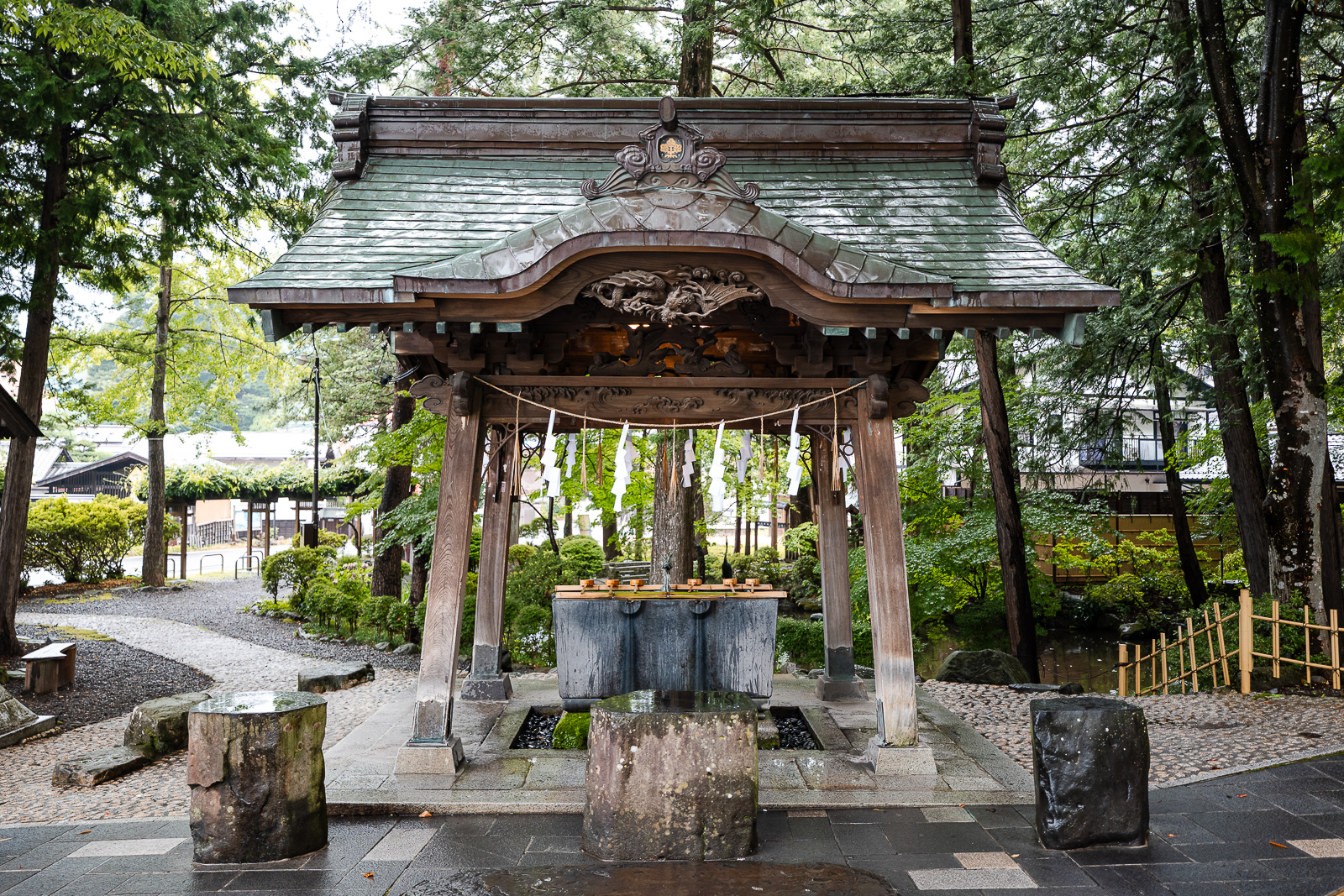 Water purification at the main torii entrance at suwa taisha shimosha akimiya