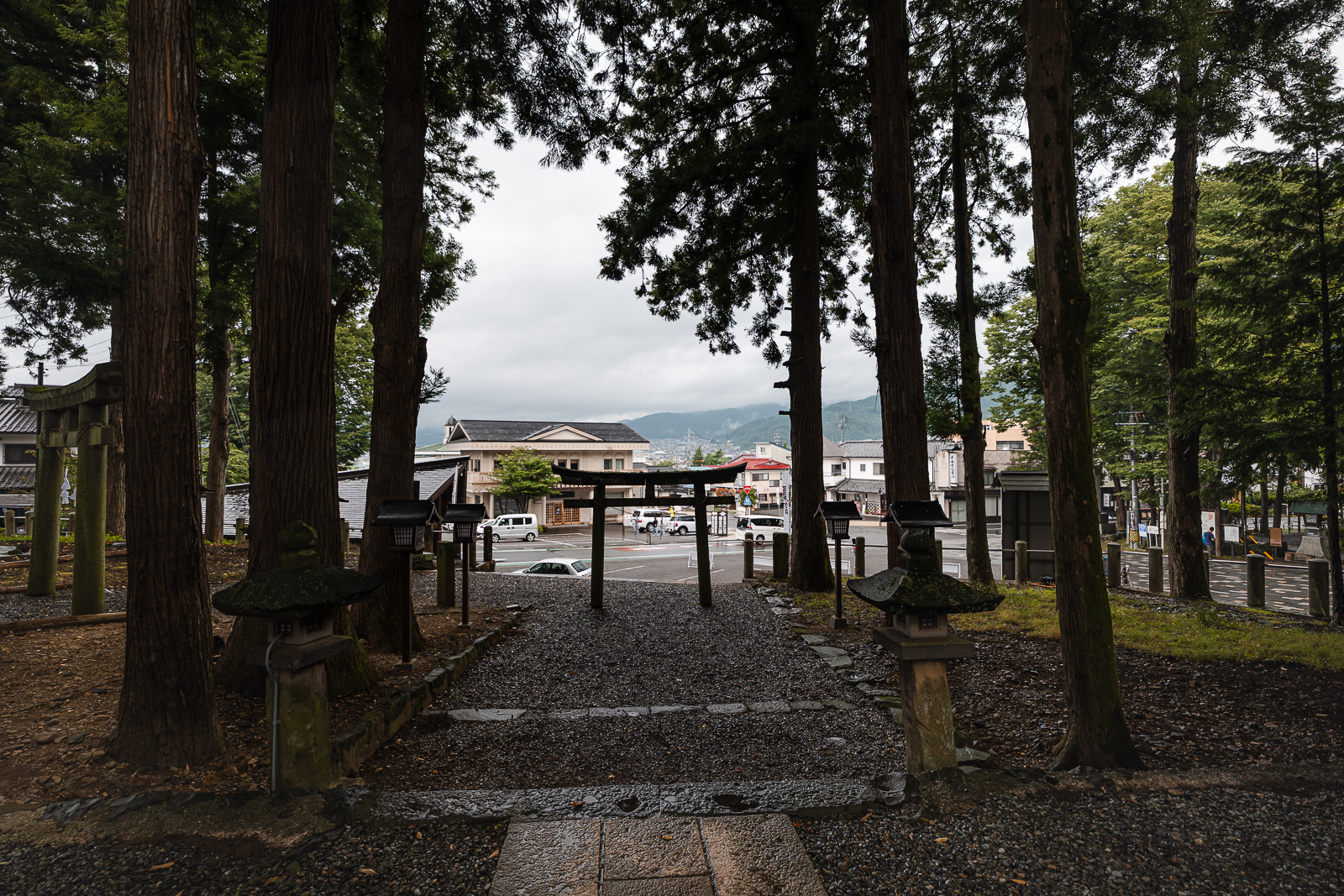 gravel courtyard and shrine buildings at Suwa Taisha Shimosha Akimiya in Shimosuwa Nagano