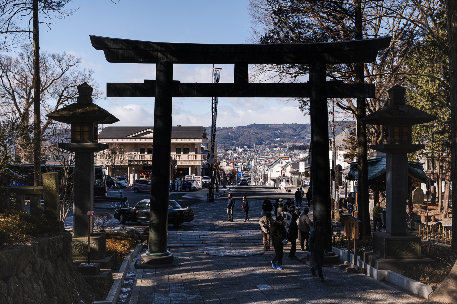 torii gate with Lake Suwa beyond at Suwa Taisha Shimosha Akimiya in Shimosuwa Nagano